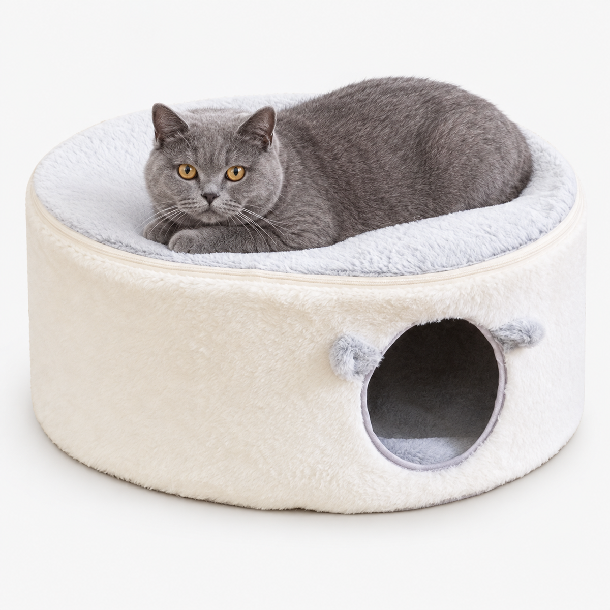 Cats resting in a plush cave bed