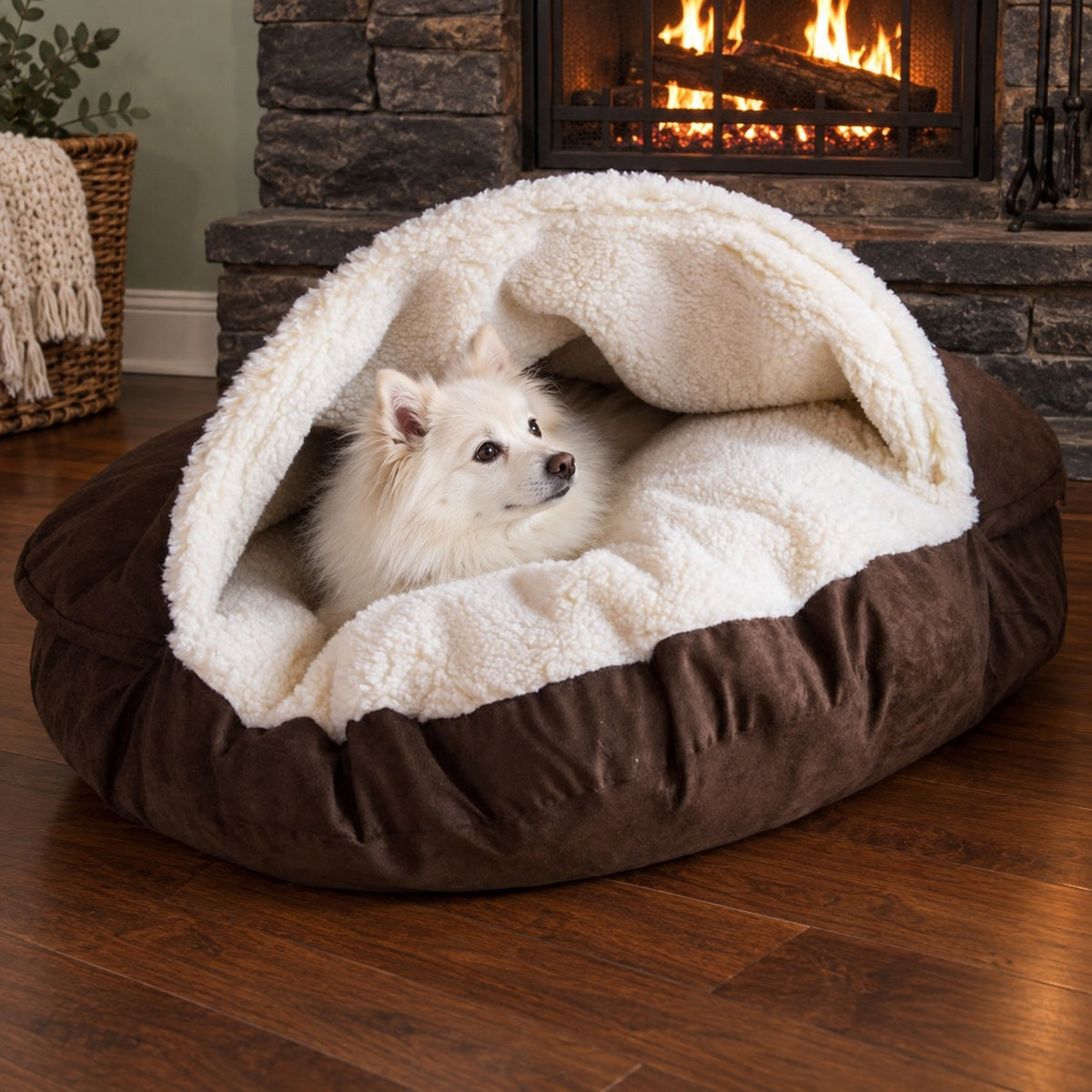 Dog snuggled in a soft cave bed