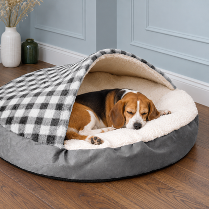 Round checked canopy dog bed in a living room