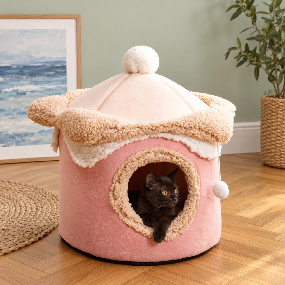 Pink ice cream cave bed with a dark kitten