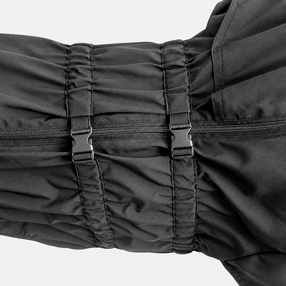Close view of adjustable dog raincoat buckles