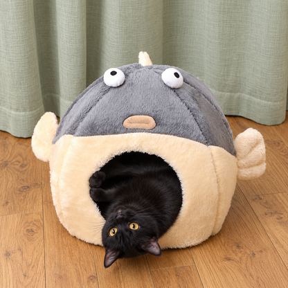 Pet resting upside down inside the pufferfish bed